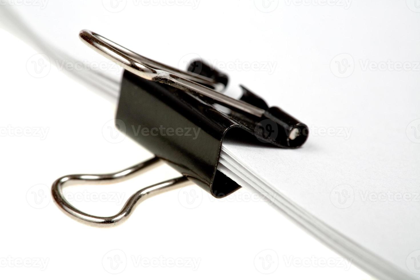 binders clip on sheets of paper photo