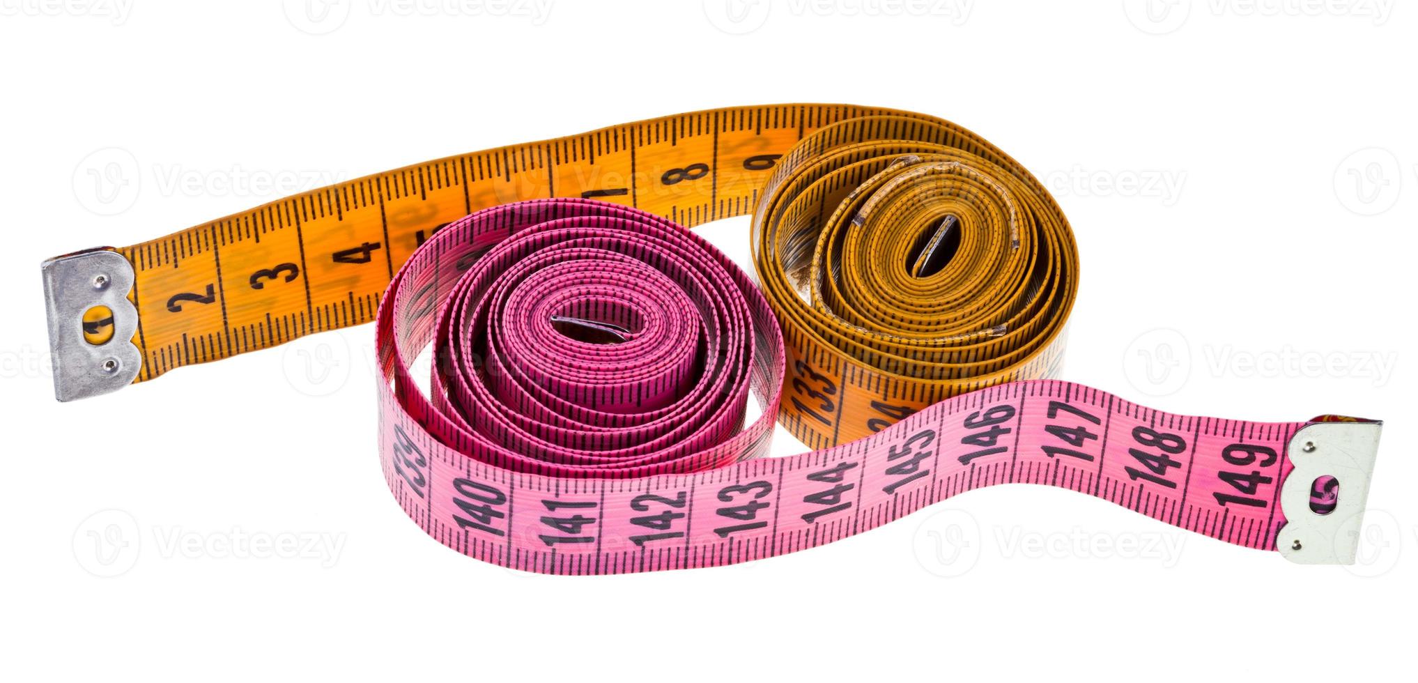 yellow and pink measure tapes photo
