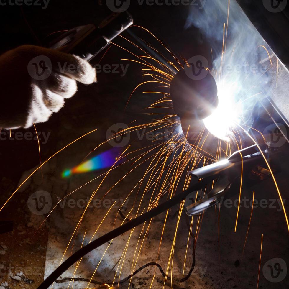 welding car body in snow field photo