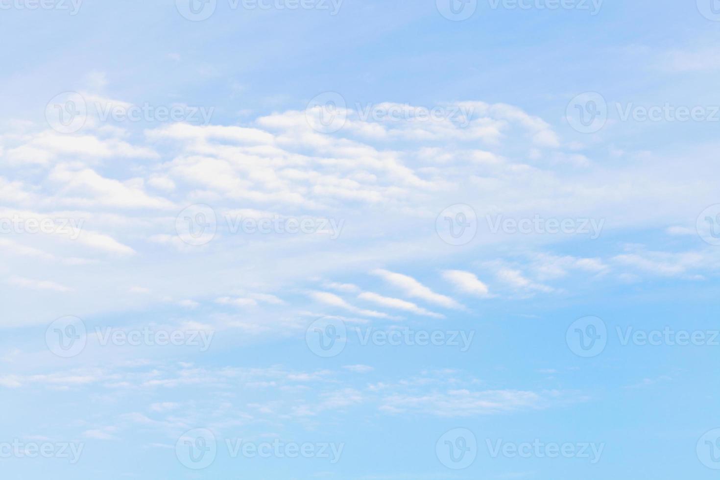 cirrus white clouds in blue sky in winter photo