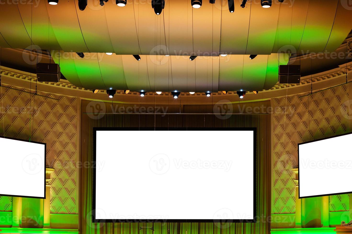 screens in yellow and green illuminated cinema photo