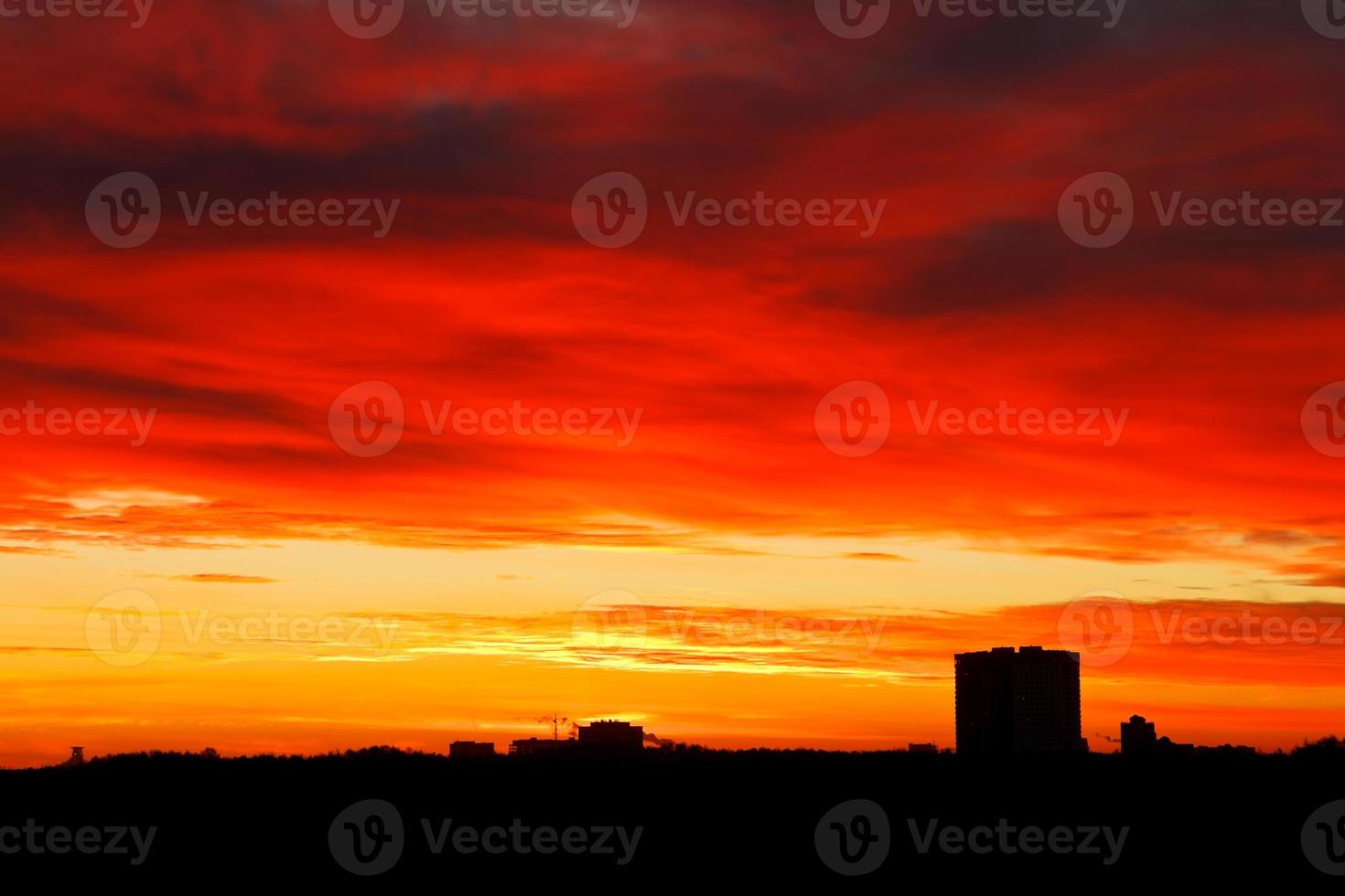 dramatic dark red and yellow sunrise sky photo