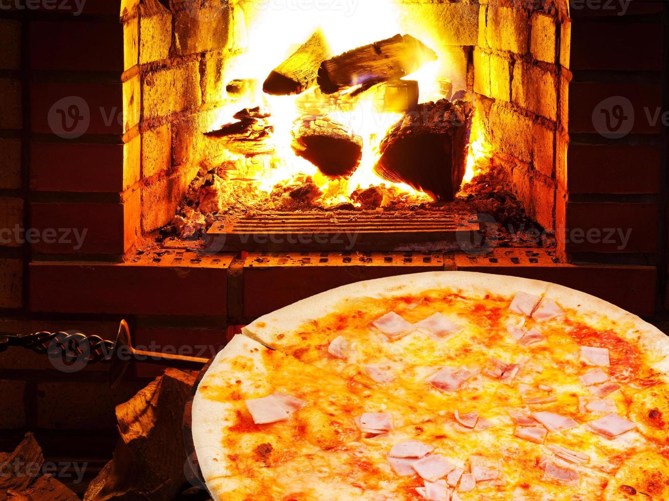 pizza with prosciutto cotto and open fire in oven 11693352 Stock Photo at Vecteezy