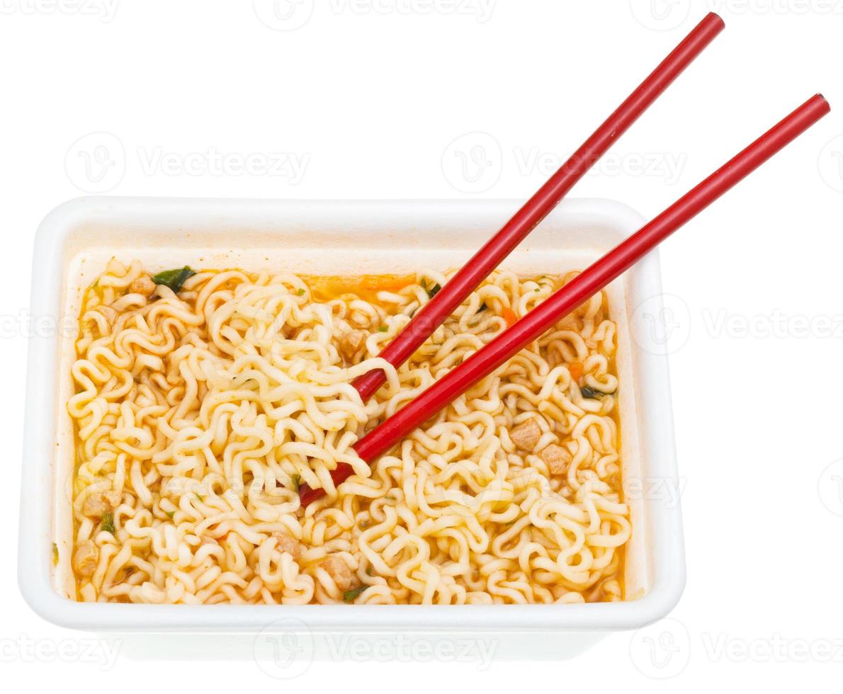 eating of cooked instant noodles photo