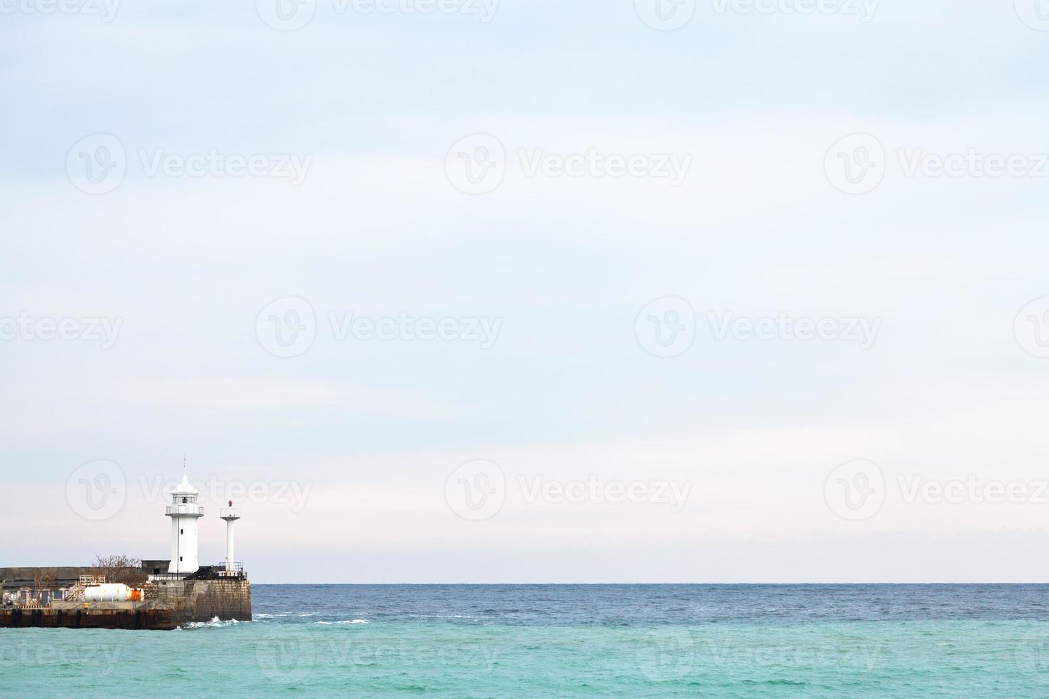 Black Sea and lighthouse in Yalta in autumn photo