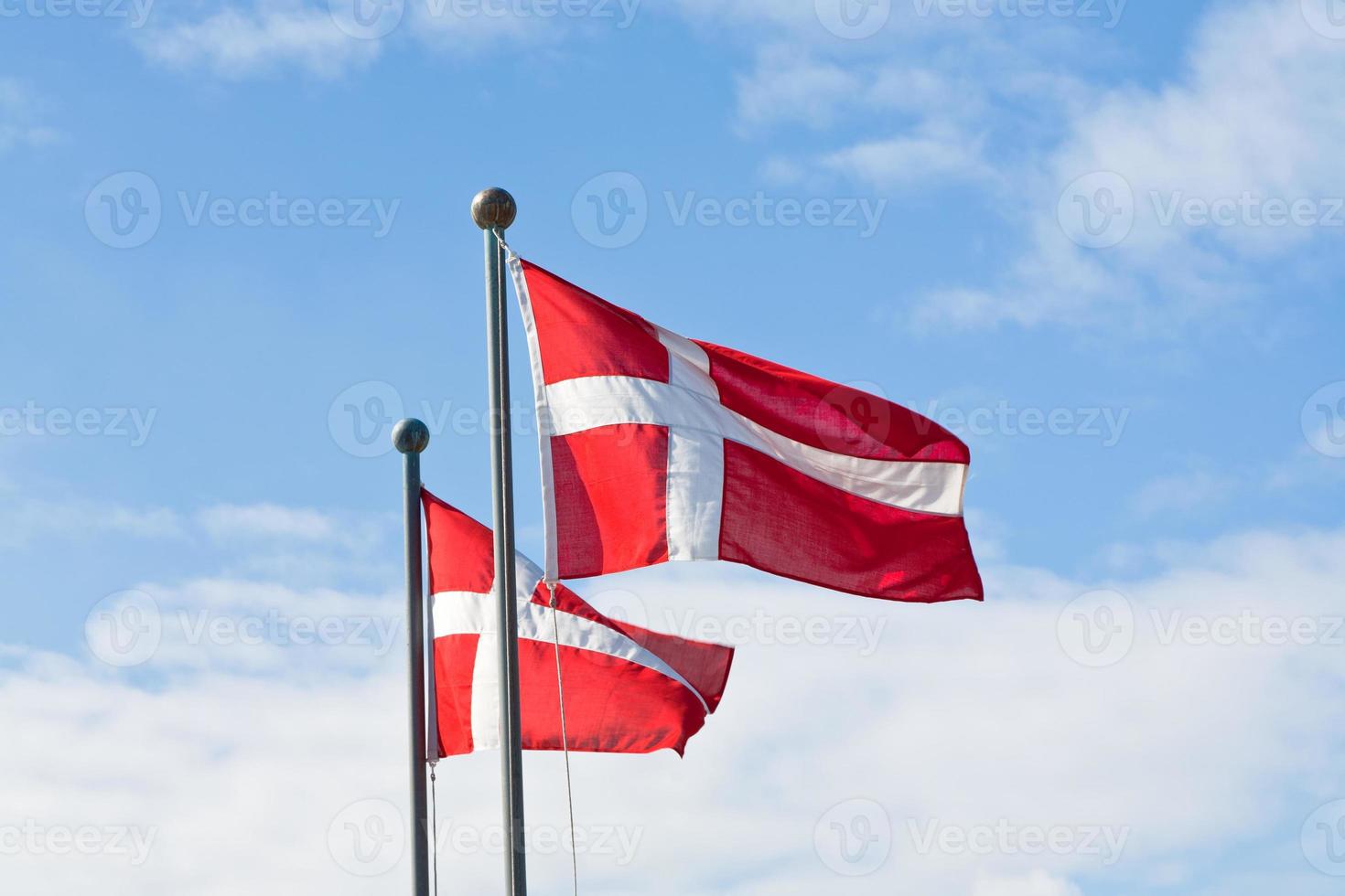 danish flags and blue sky photo