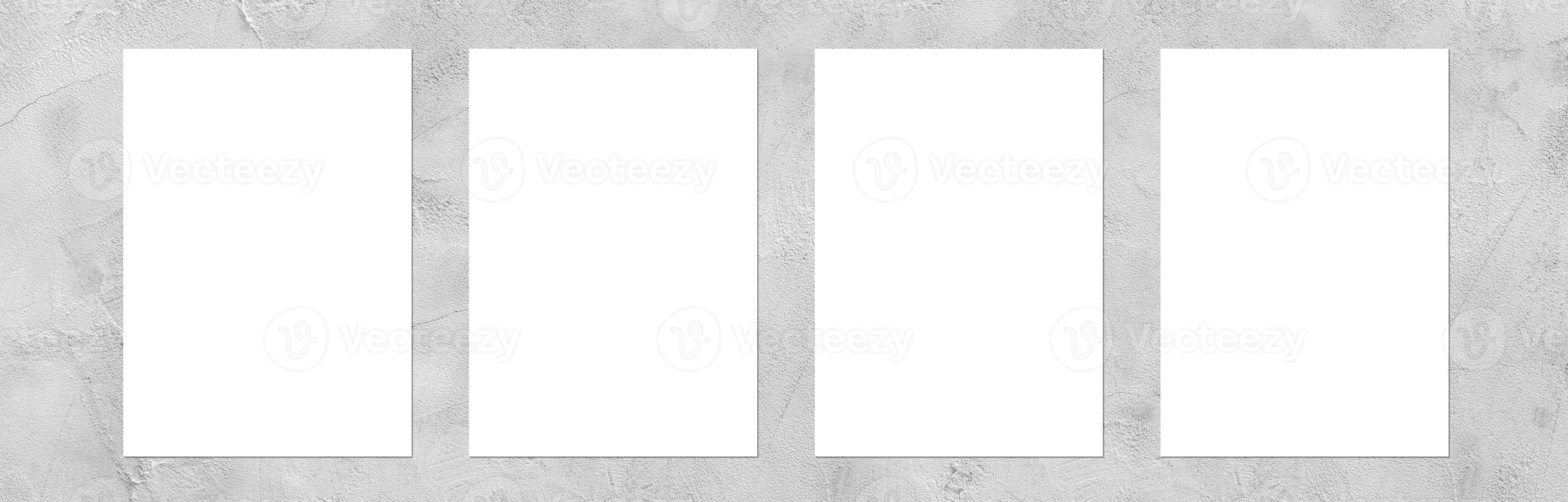 Empty white horizontal rectangular poster mockup with light shadow on gray concrete wall background. photo