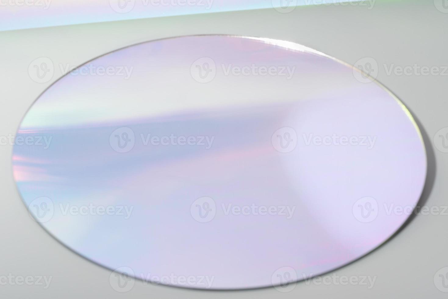 round mirror on grey background with trendy gradient reflection in lilac tones. Empty scene for product presentation. display stage. high angle view. copy space. photo
