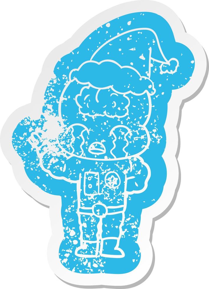 cartoon distressed sticker of a big brain alien crying wearing santa hat vector