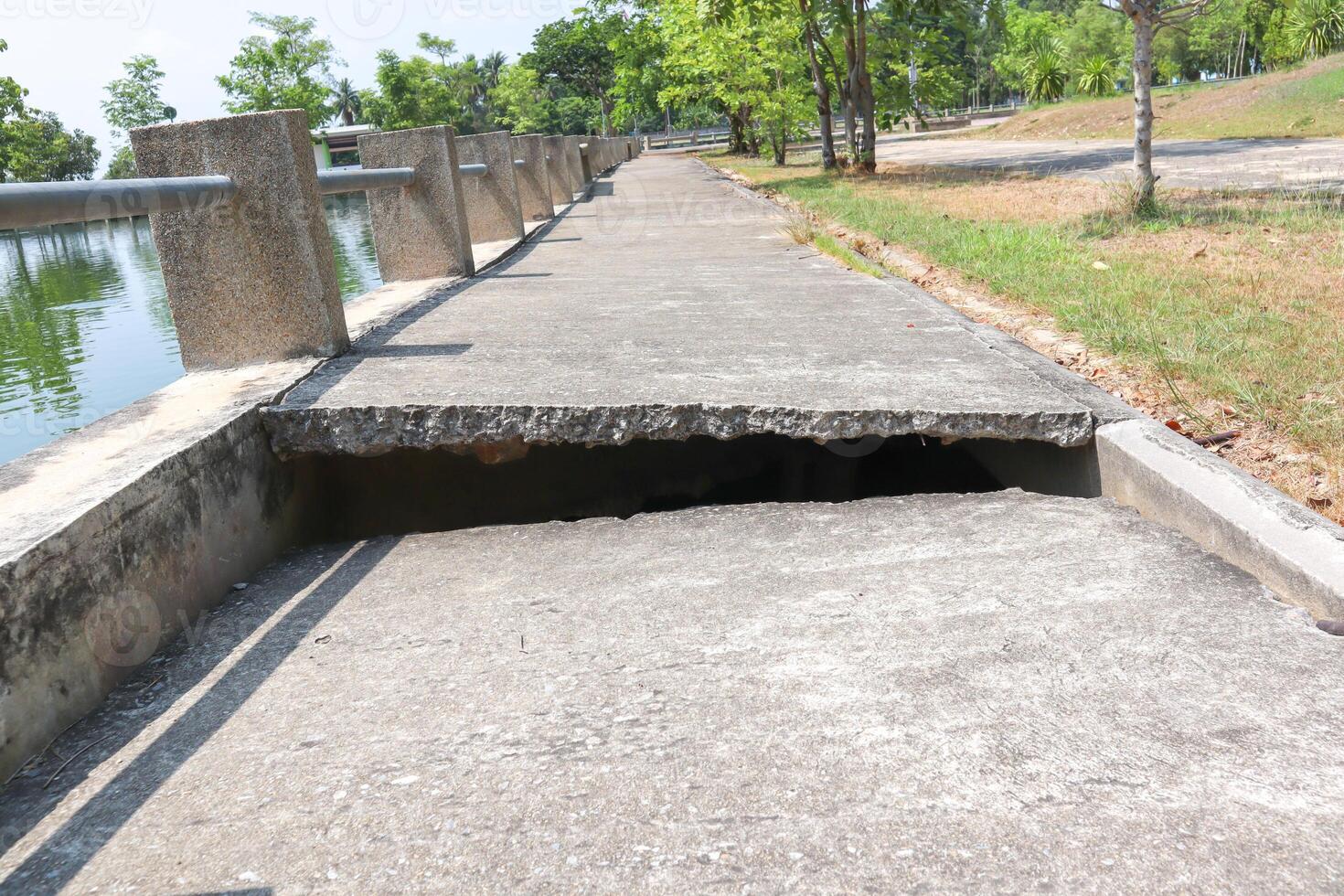 Concrete road with cracks With the shadow of the sunlight photo