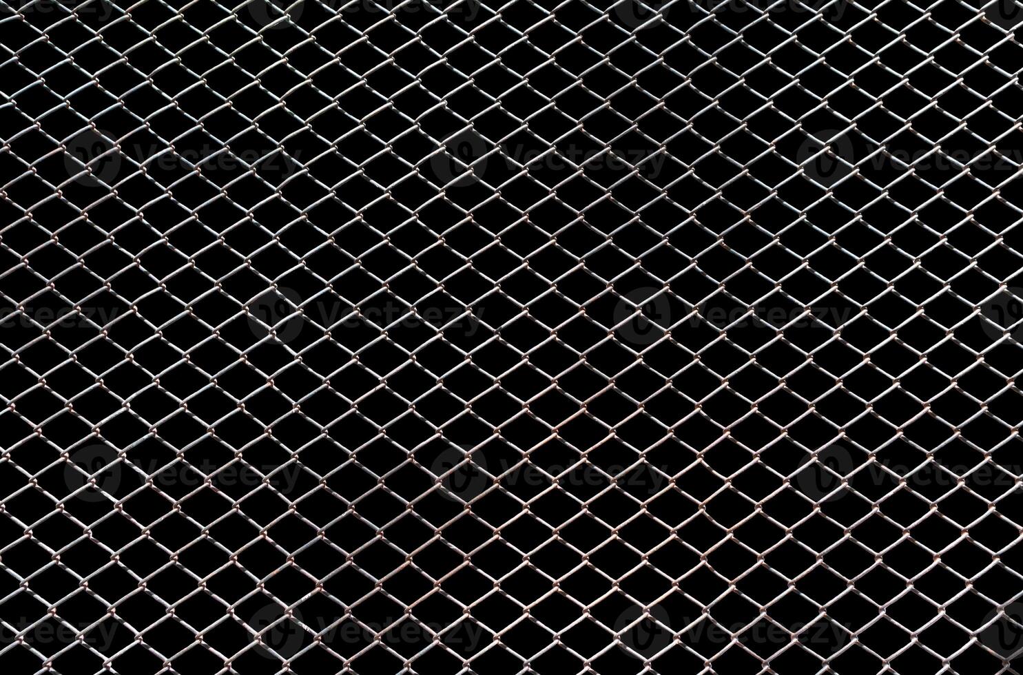 Steel mesh wire fence isolated on black background with clipping path photo