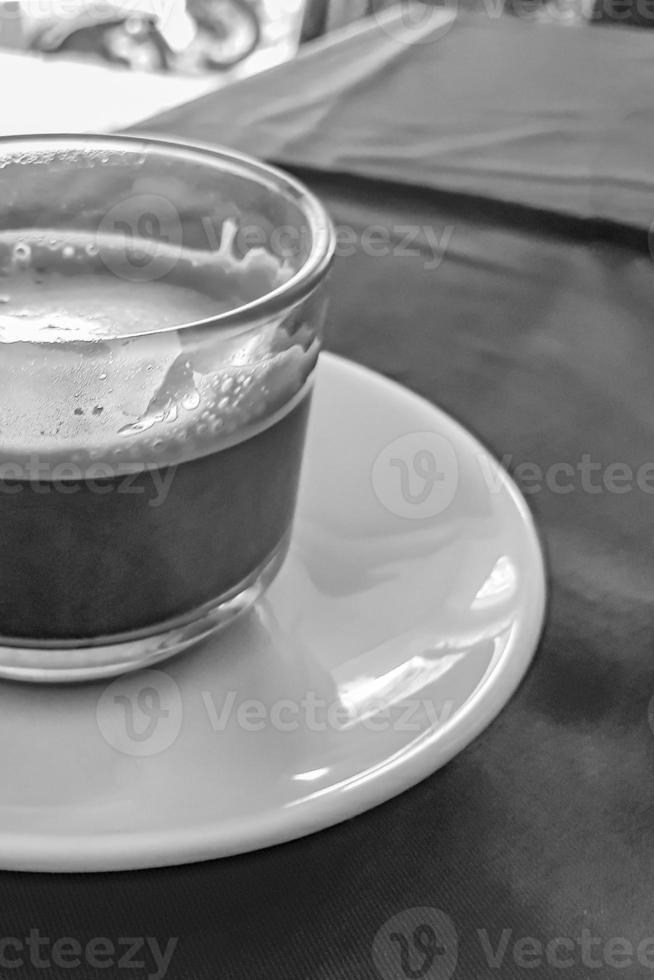 Glass Cup of black coffee in a restaurant Phuket Thailand. photo