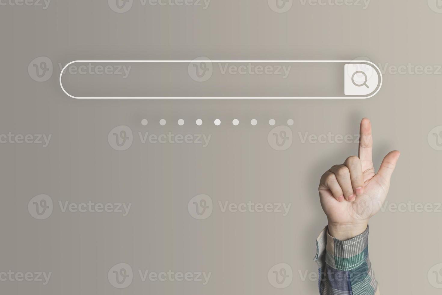 Businessman's finger pointing at internet search page on virtual touch screen brown earth tone background, search for internet surfing information network concept, education, knowledge, copy space photo