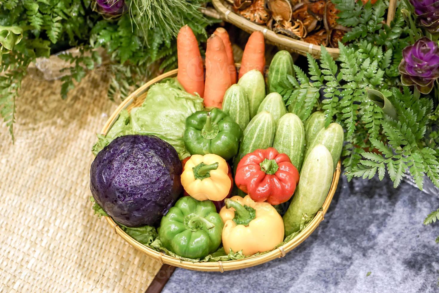 Sample Vegetables that are beneficial to the body Colorful Bell peppers, Cucumbers, Purple cabbages and Carrot show in food and market fair. photo
