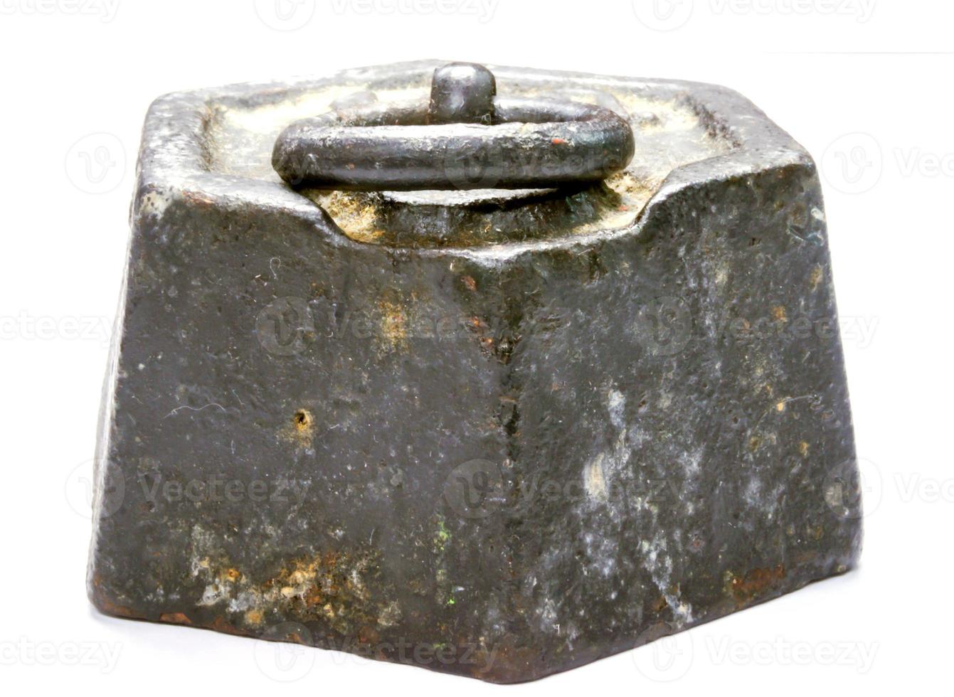 The ancient of 1 KG. Steel weight pendulum on white background. photo