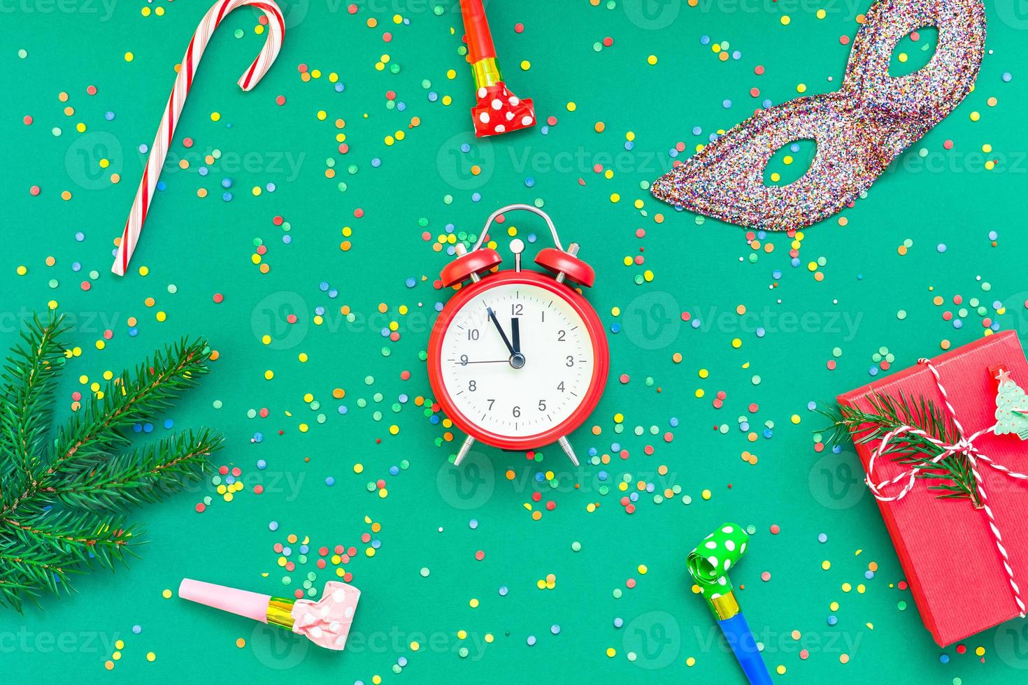 Christmas pattern flat lay with red alarm clock photo