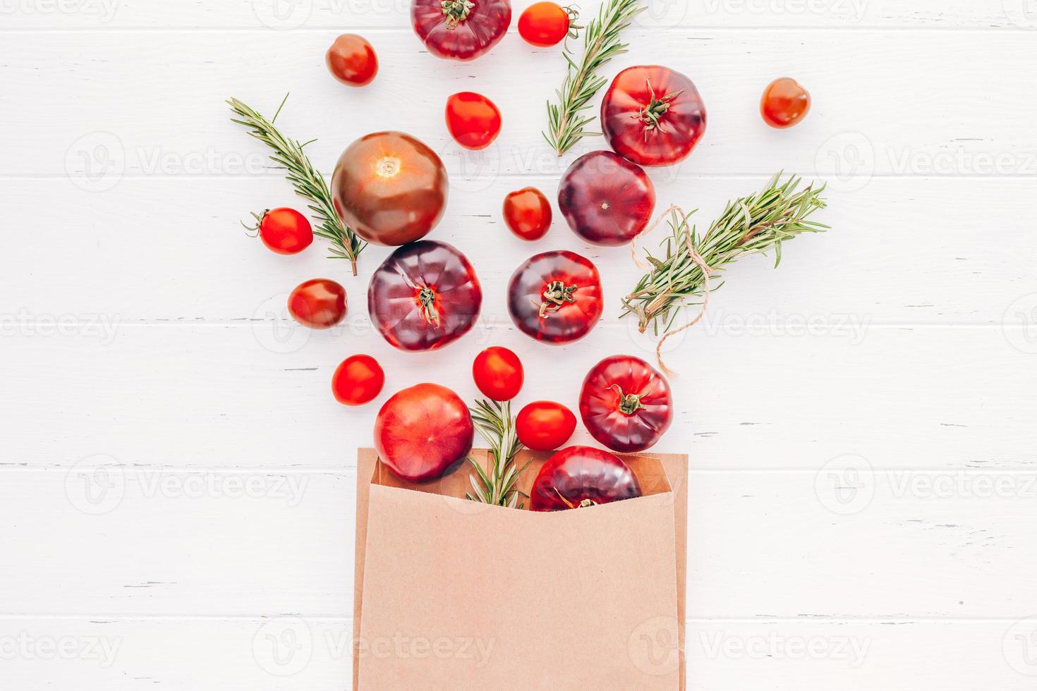 Tomatoes Mar Azul on white wooden table background photo