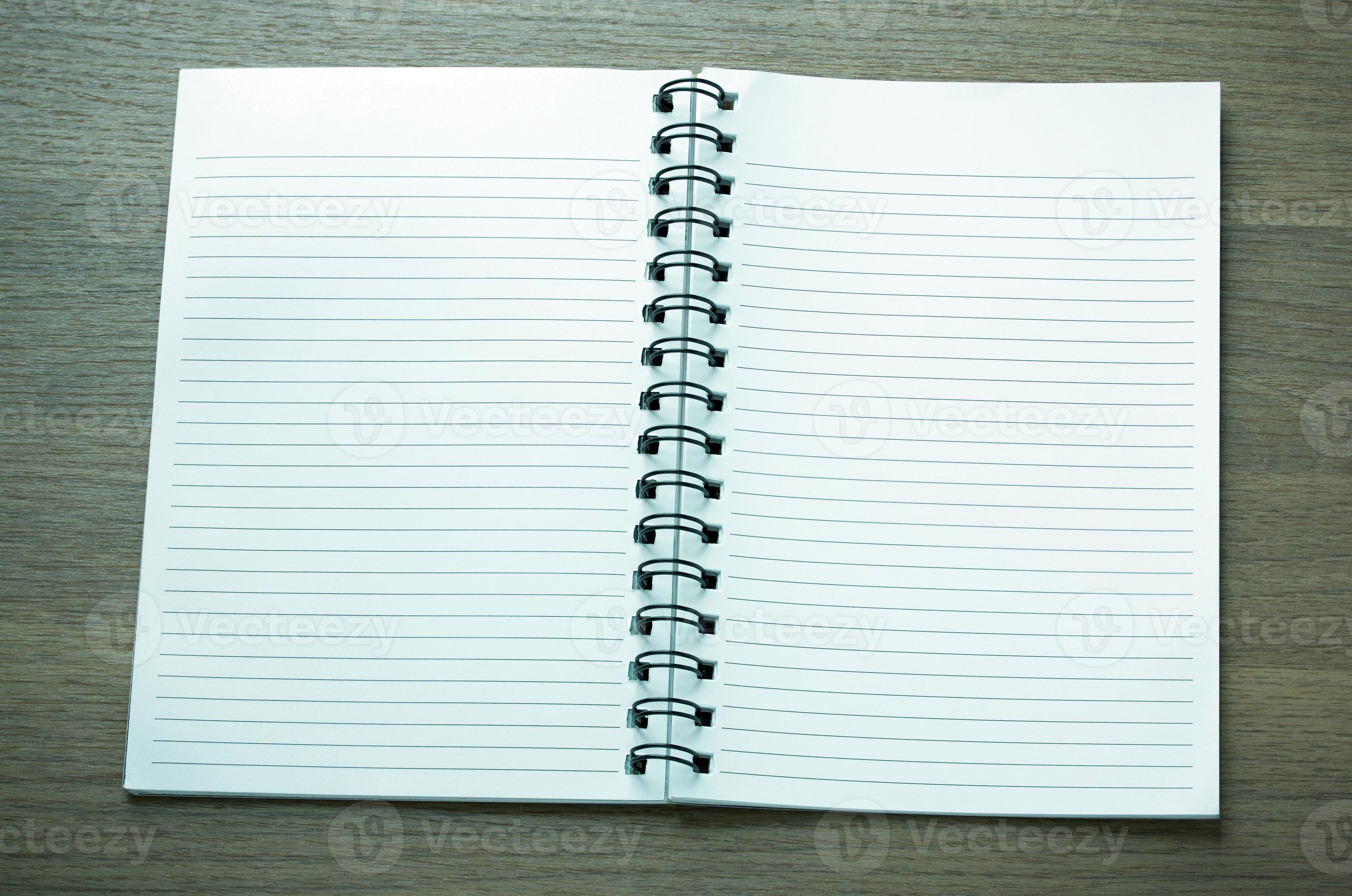 open spiral notebook on dark wood background 11701835 Stock Photo at