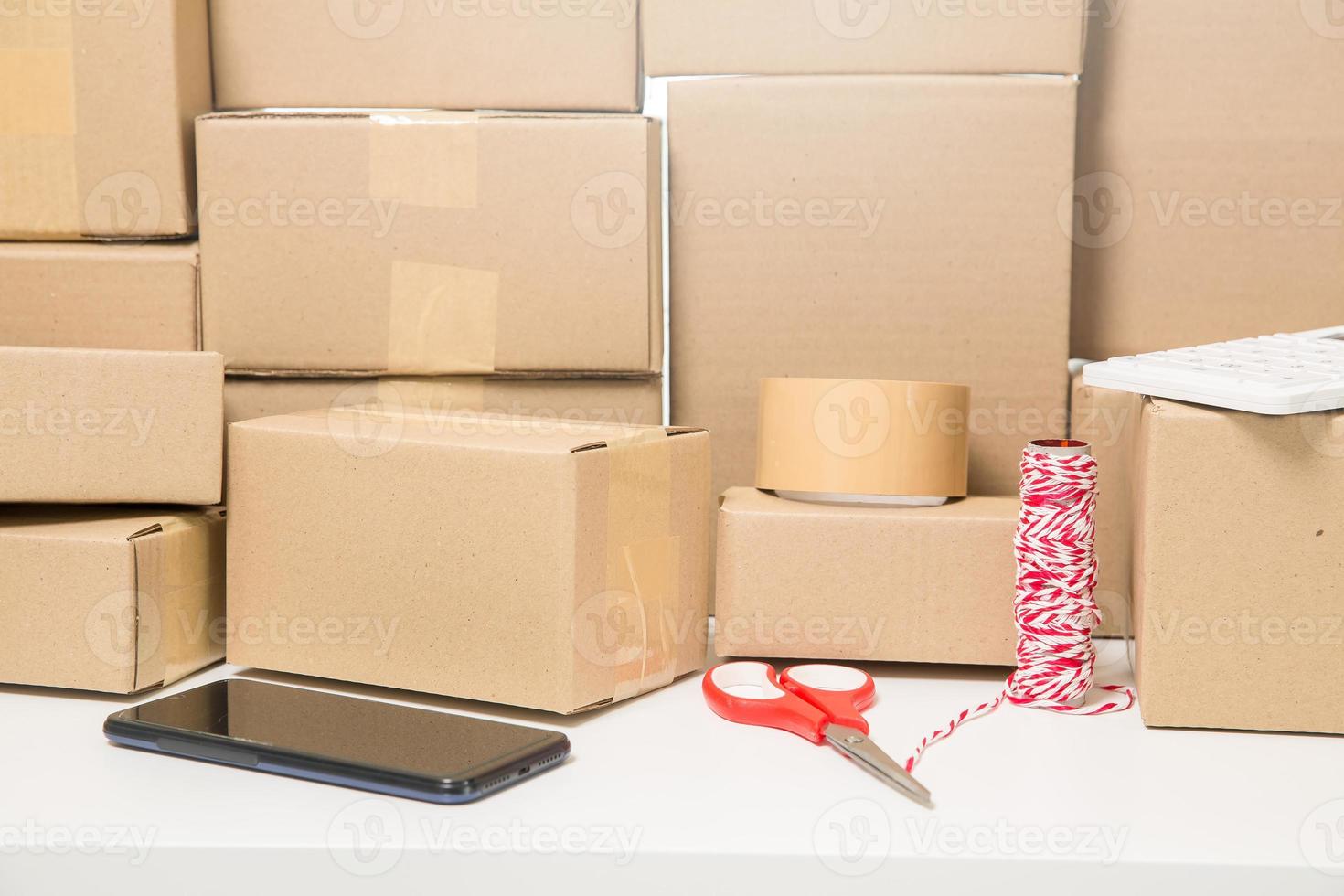 Equipments for SME online business, delivery business laptop, barcode, boxes, checking product on stocks or cardboard parcels. Small business working at home office. delivery service product at home. photo