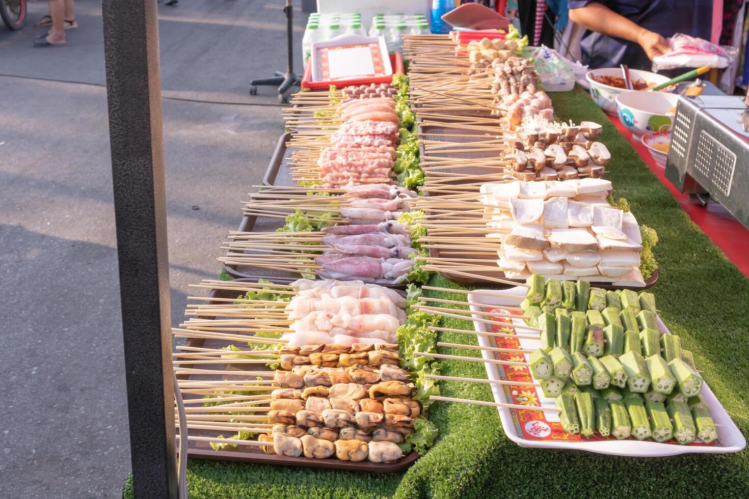 Raw material skewered on wood Waiting to be grilled and then coat with chilli mala. photo