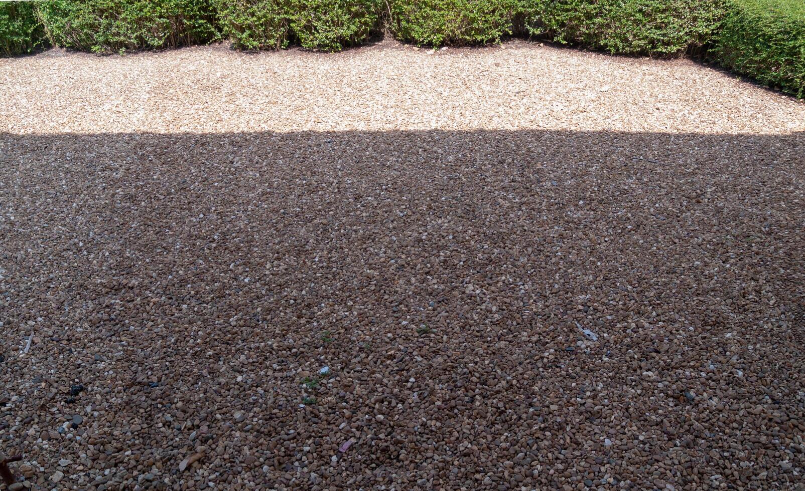 The gravel floor with the shadow of the sun on top With tree on top, The image of panorama view photo