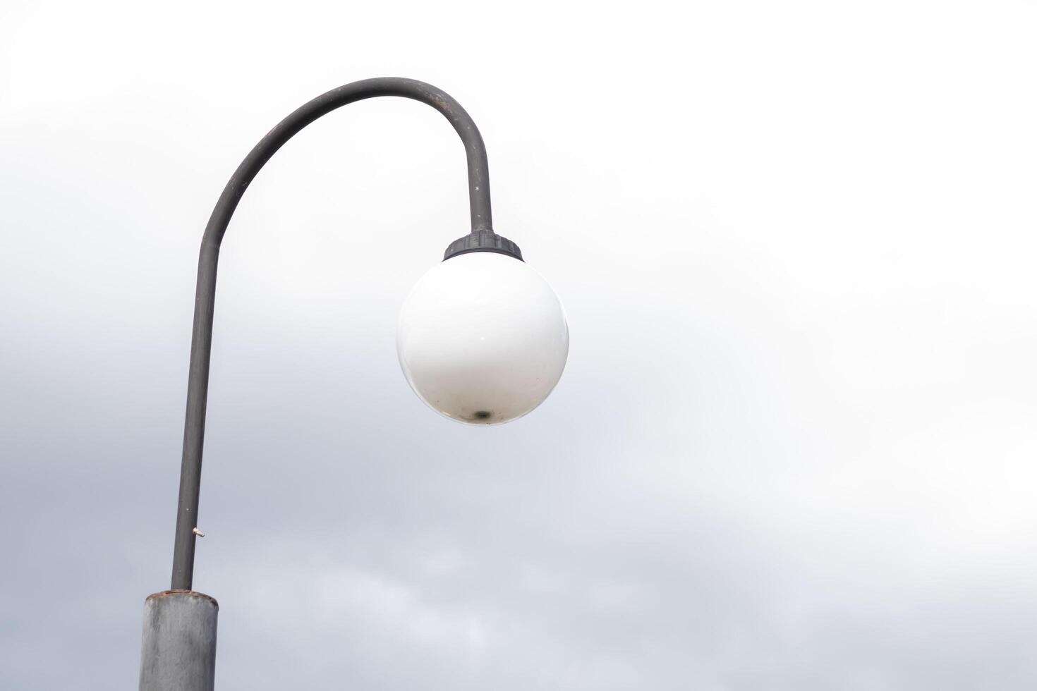 Lamp on the pole beautiful blue clear sky with white clouds background in sunny day and copy space. Nature bright sky background image. Summer blue sky. Texture for Design. Natural cloudy Wallpaper. photo