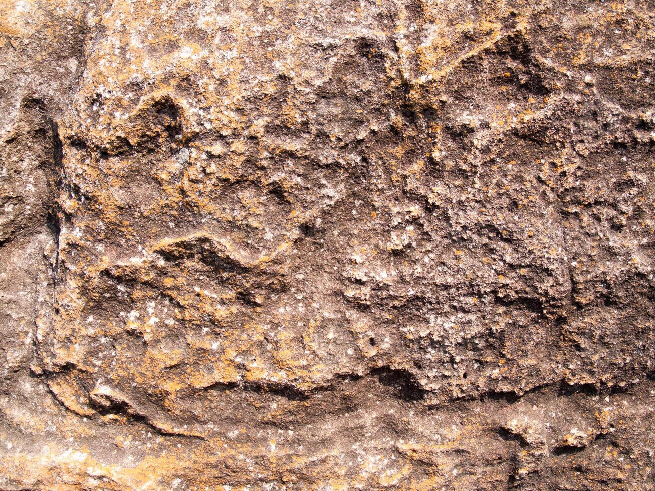 The texture of stone used for background images, Surface of stone brown color photo