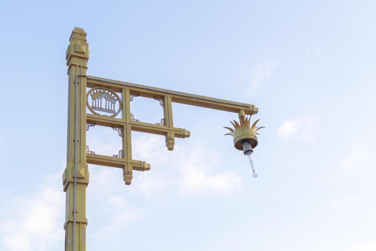 The lamp on the pole With a blue sky background photo