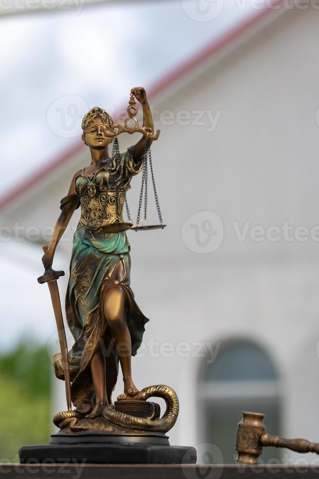 Statue of Themis against a stormy sky. Symbol of justice and law, crime and punishment. photo