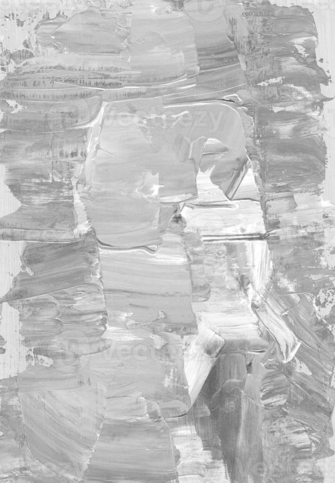 Abstract light gray textured background. Monochrome backdrop. Grey and white painting. Brush strokes on paper. photo