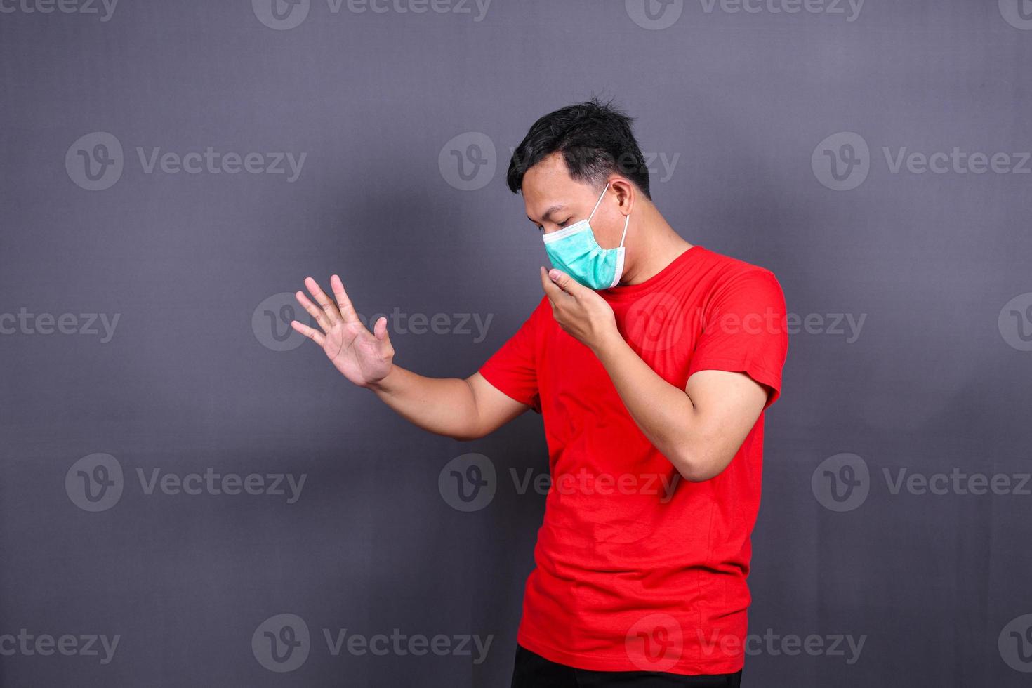 Man wearing hygienic mask to prevent infection, airborne respiratory illness such as flu, 2019-nCoV. Isolated on white background photo