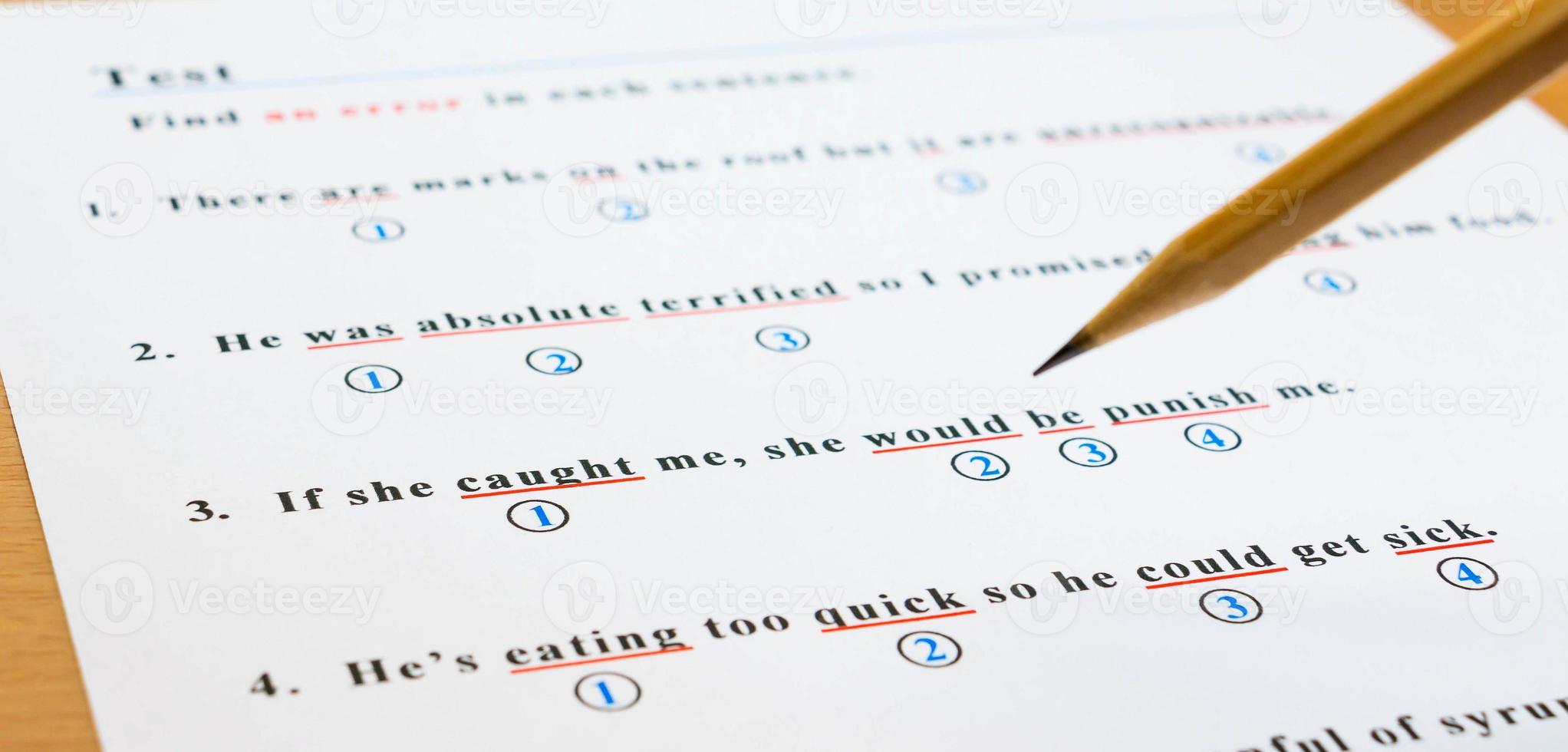 english test and answer sheet on table photo