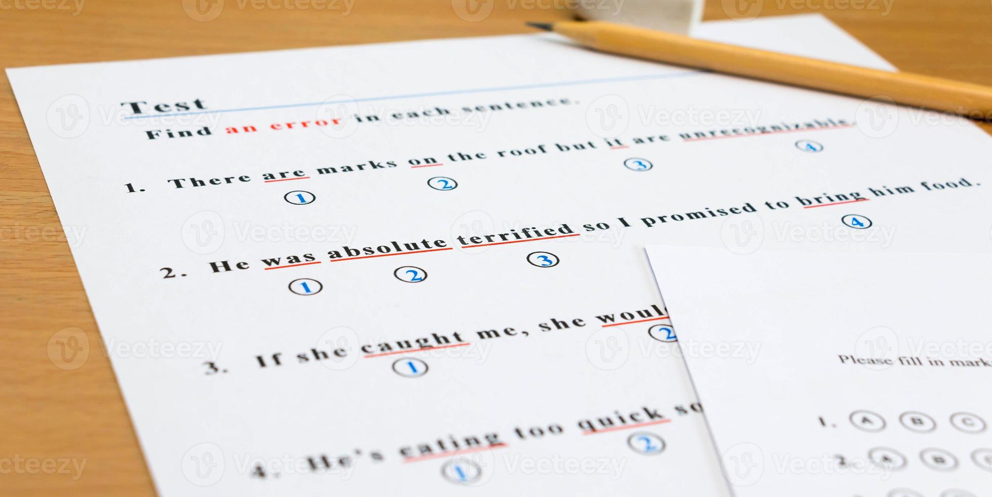 english test and answer sheet on table photo