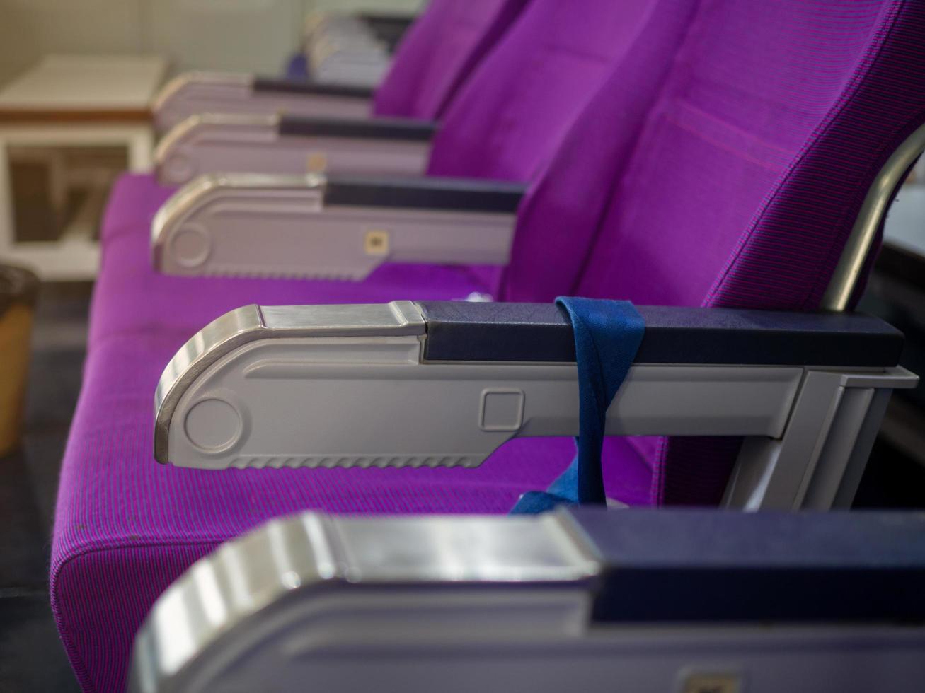 Seats lined up on the plane photo