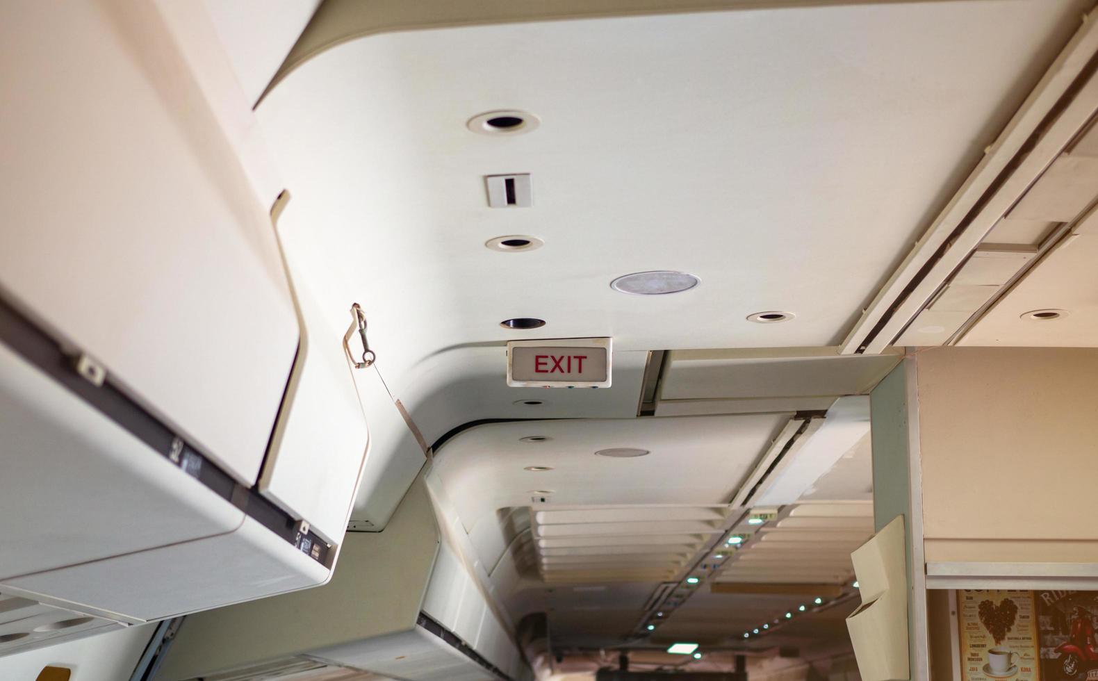 Emergency Exit sign on a passenger plane photo