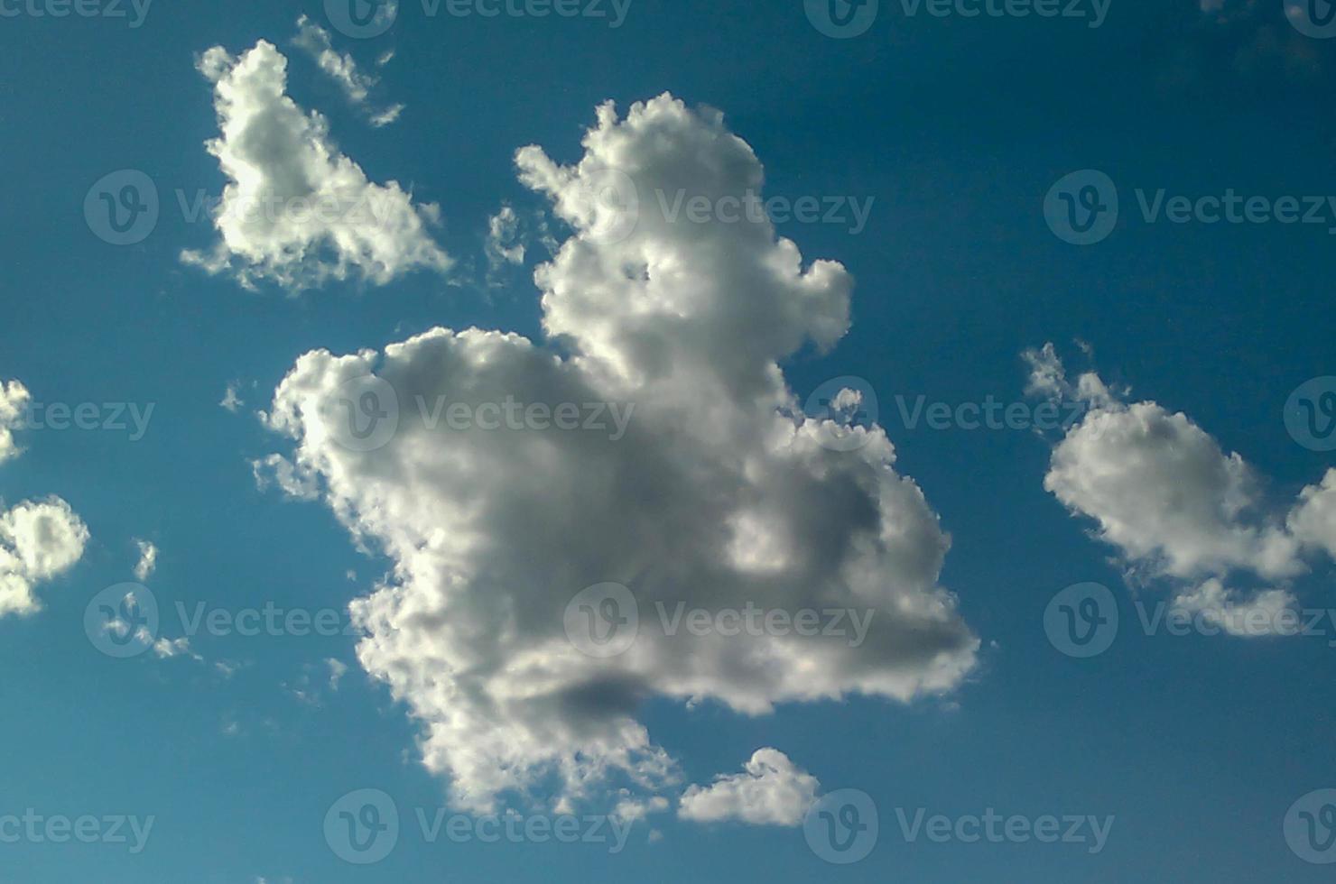 The beautiful shape of clouds on the bright blue sky, sky and clouds background. photo