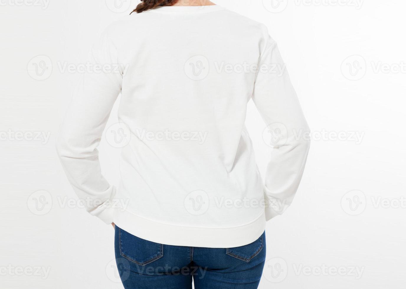 woman in white pullover posing on white background - back view cropped image photo