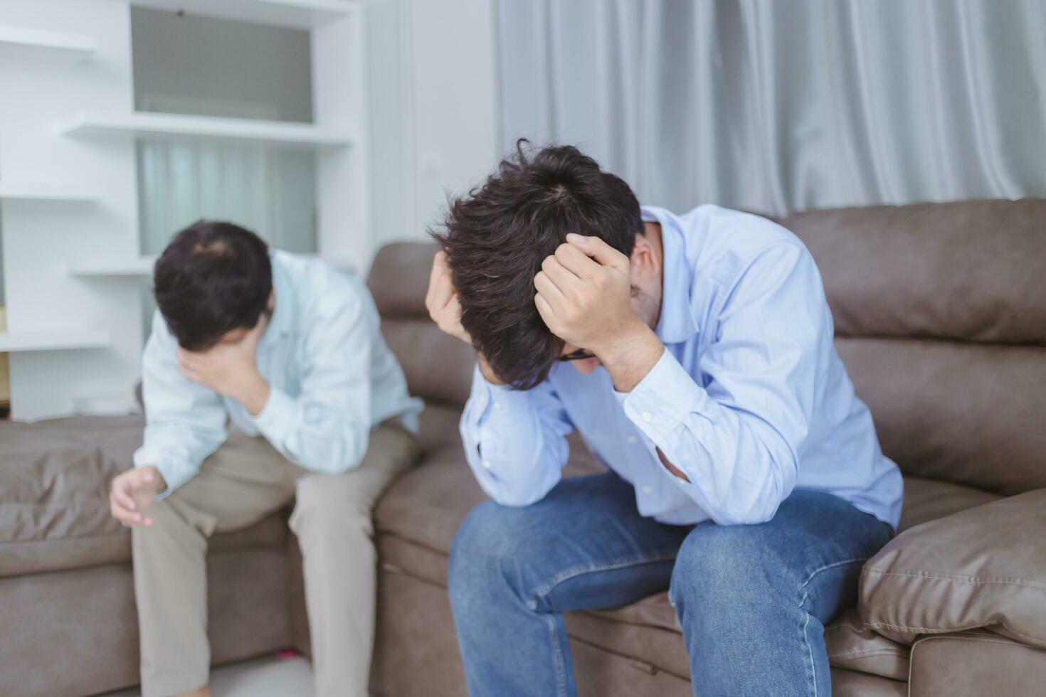 A man sitting in distress with his lover. photo