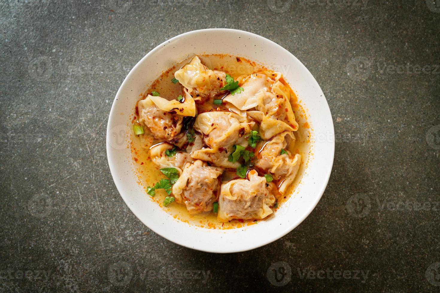 pork wonton soup or pork dumplings soup with roasted chili photo