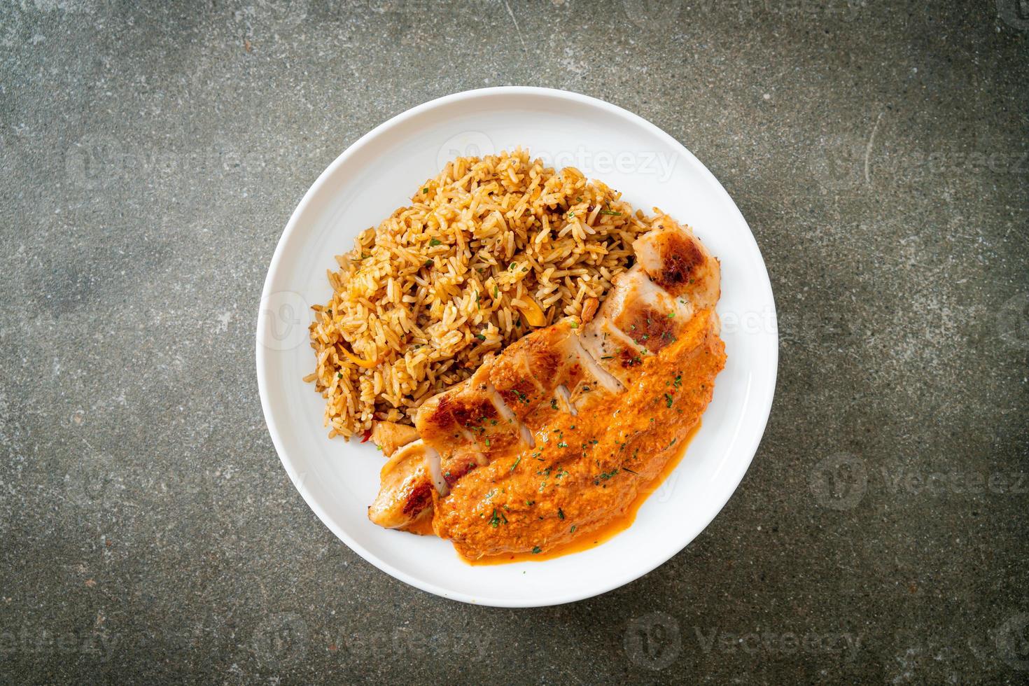grilled chicken steak with red curry sauce and rice photo