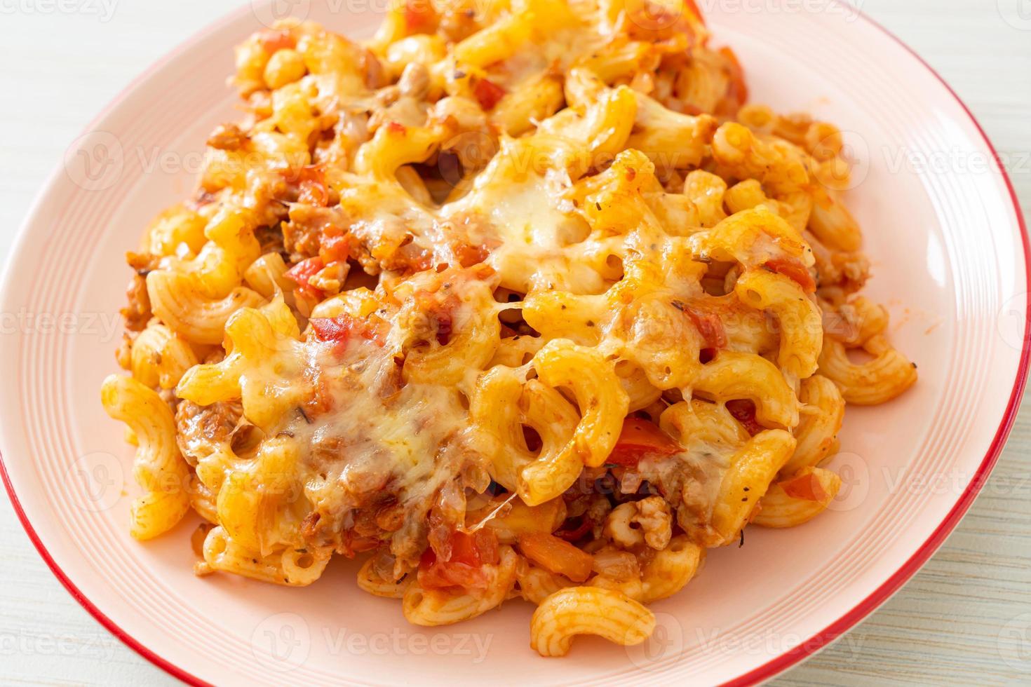 homemade macaroni bolognese with cheese photo