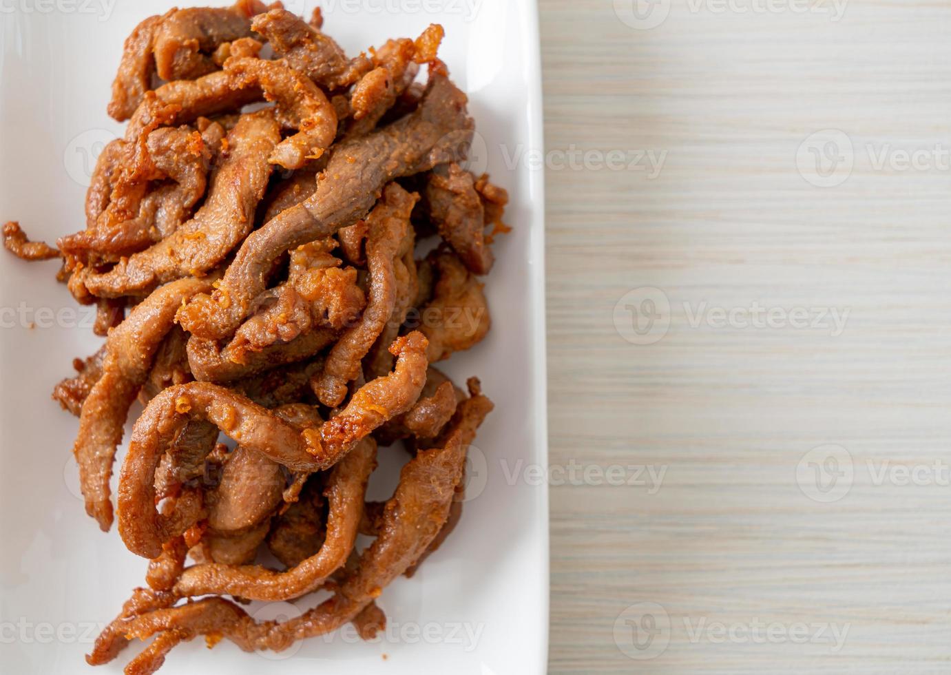 Sun-Dried Pork on white plate photo