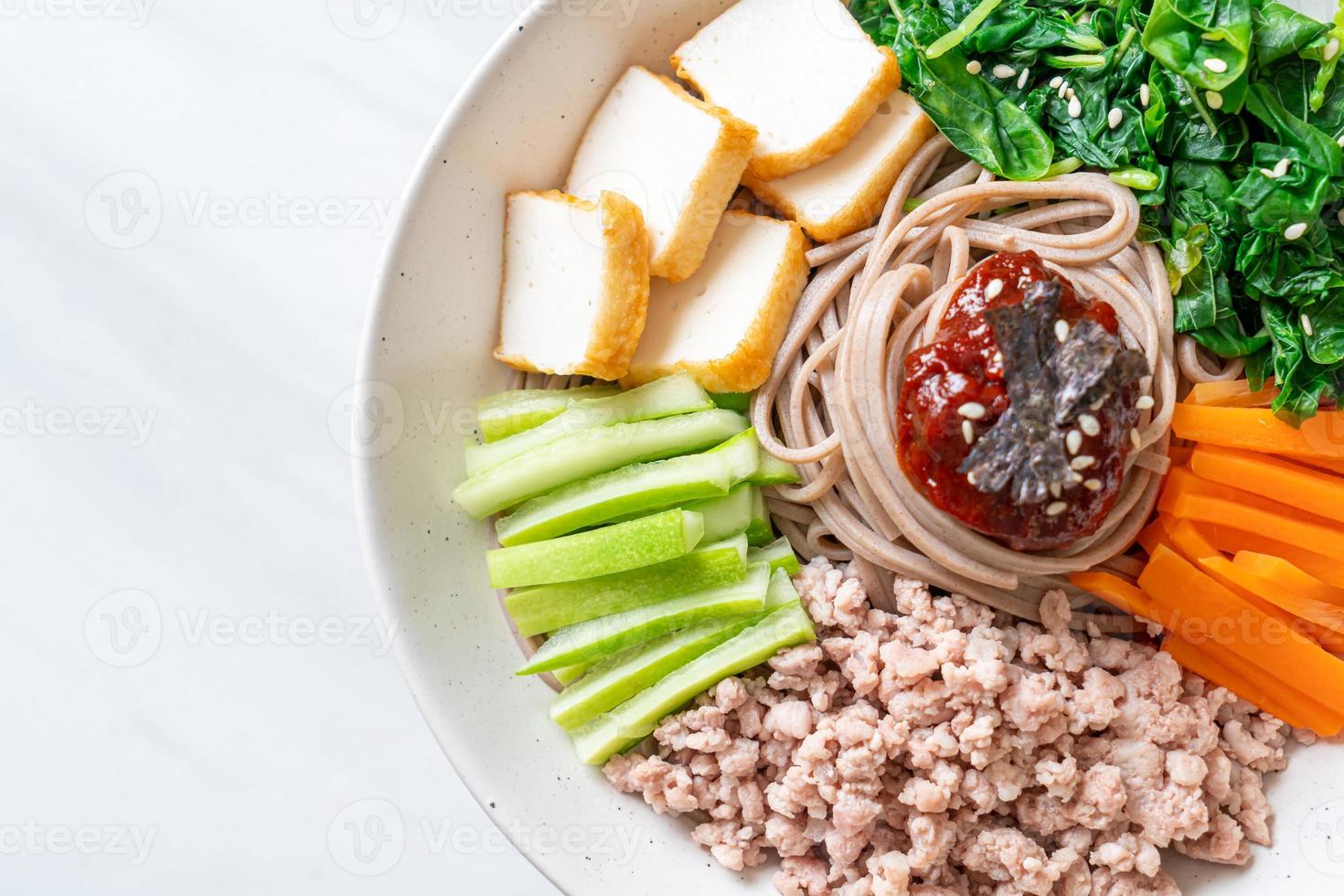 Korean spicy cold noodles 11705941 Stock Photo at Vecteezy