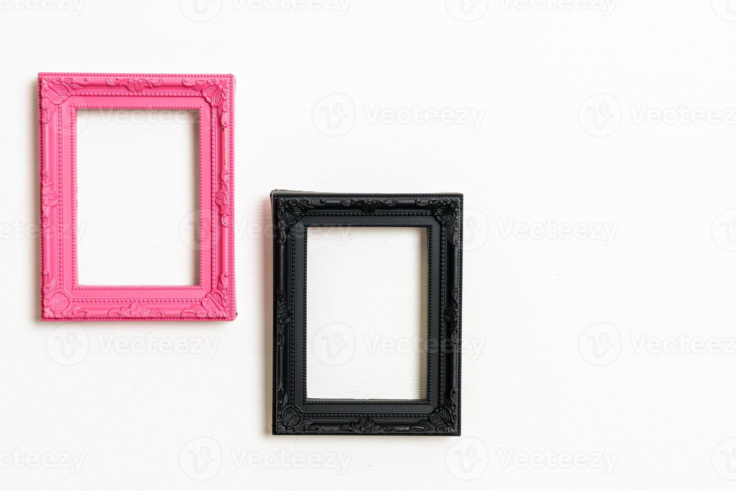 empty picture frame on white wall background photo