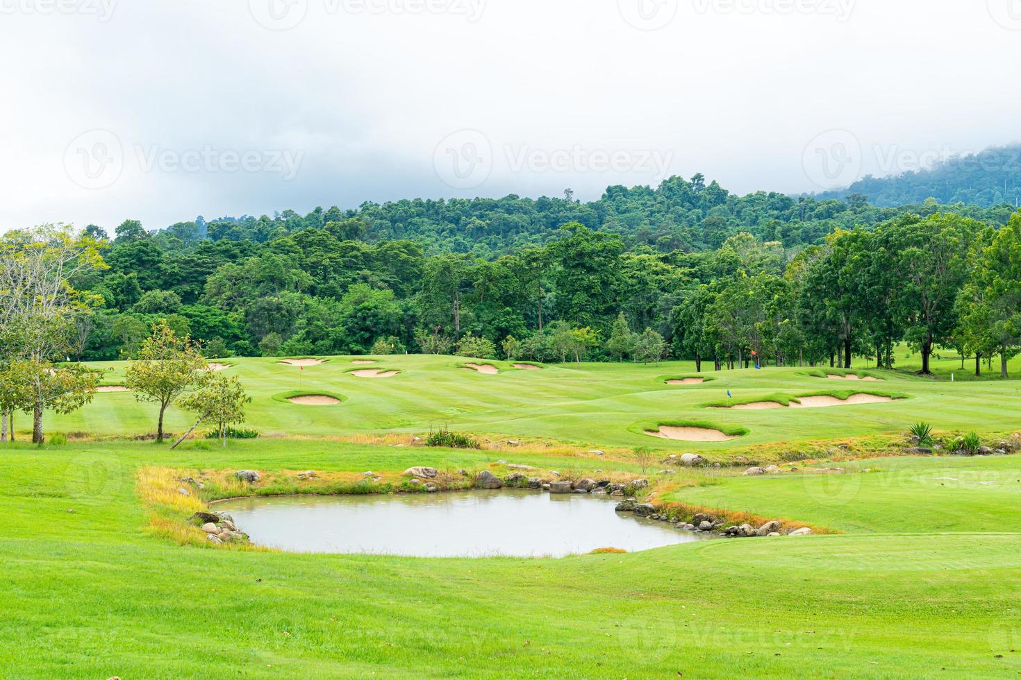 Green with Sand bunkers on Golf course photo