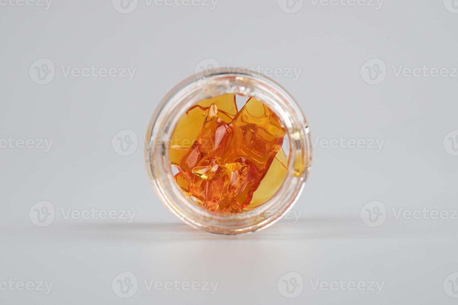 orange golden extract dab cannabis in bottle photo