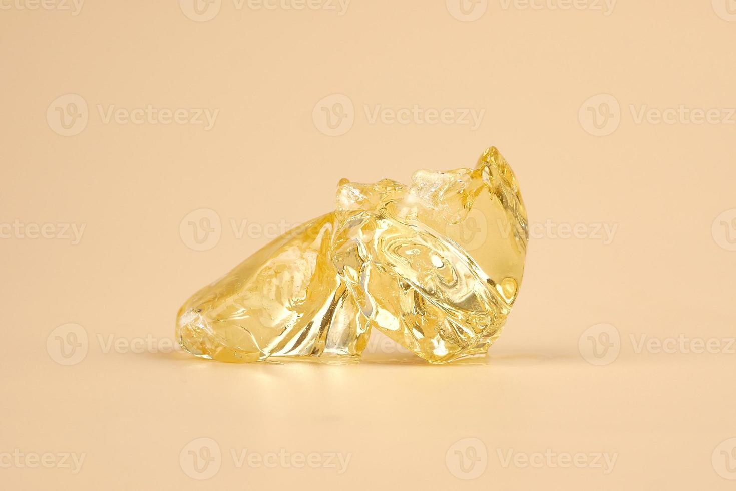 yellow wax piece with high THC, clear cannabis resin stone photo