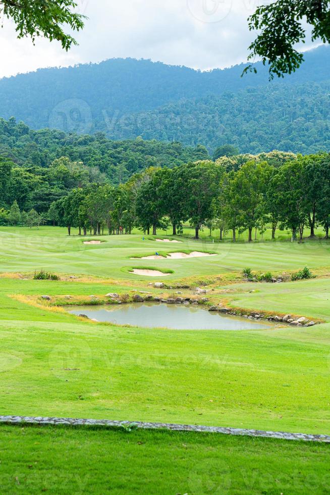 Green with Sand bunkers on Golf course photo