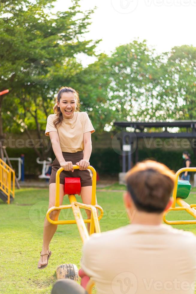 Asian couple love play seesaw photo