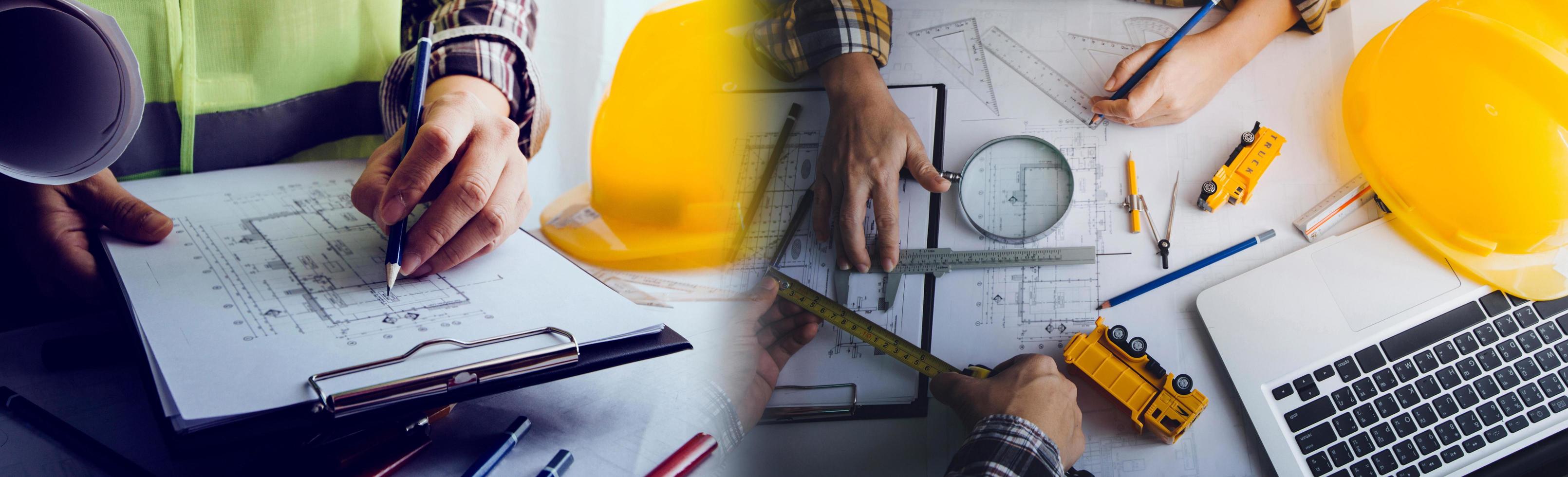 business hand working and laptop with on on architectural project at construction site at office desk in office photo